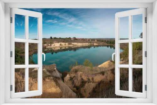 Fototapeta Naklejka Na Ścianę Okno 3D - Wide view of a mountain lake with blue water. A natural lake with quartz rocks and a beautiful landscape in the distance. Rgotsko Lake in Serbia