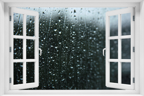 Fototapeta Naklejka Na Ścianę Okno 3D - Selective focus of rain drops on window glasses surface with cloudy background. Dramatic background concept
