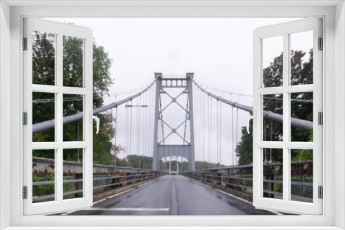 Fototapeta Naklejka Na Ścianę Okno 3D - Kingston, NY / United States - Oct.13, 2020: Landscape image of The Kingston–Port Ewen Suspension Bridge also known as the Wurts Street Bridge is a steel suspension bridge spanning Rondout Creek.
