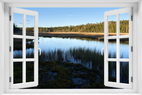 Fototapeta Naklejka Na Ścianę Okno 3D - Triungsvanna, Oslomarka, Norway. Nature reserve. Shot in golden/blue hour in october.  A crisp and cold evening in Nordmarka. This lake and forest is only a few kilometers from down town city of oslo.