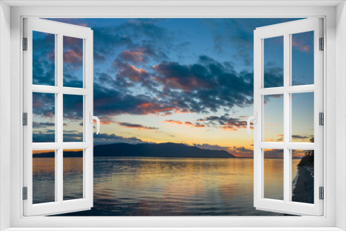 Fototapeta Naklejka Na Ścianę Okno 3D - Sunset Over Orcas Island in the Salish Sea and the San Juan Island Archipelago. Beautiful and dramatic sunset with colorful clouds and a calm sea in the Pacific Northwest.