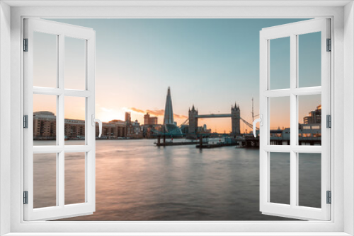 Fototapeta Naklejka Na Ścianę Okno 3D - London Tower Bridge and skyline at sunset - Beautiful view of London with Thames river on foreground and famous landmarks in the centre of the frame - travel and architecture