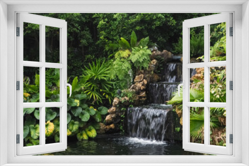 Fototapeta Naklejka Na Ścianę Okno 3D - A waterfall in a stream in a fertile rainforest