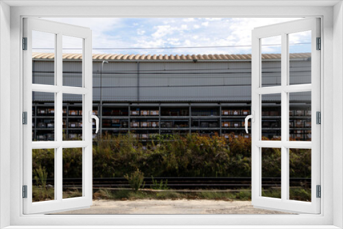 Fototapeta Naklejka Na Ścianę Okno 3D - View of a factory in the countryside