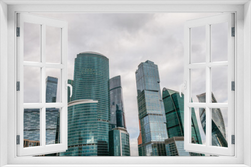 Skyscraper towers against the background of the autumn cloudy sky