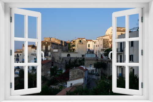 Fototapeta Naklejka Na Ścianę Okno 3D - View on old houses of medieval small touristic coastal town Sperlonga and sea shore, Latina, Italy on sunrise