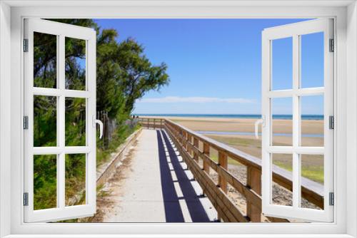 Fototapeta Naklejka Na Ścianę Okno 3D - wooden pontoon walkway on sandy beach side in atlantic ocean coast horizon in Jard sur Mer in france