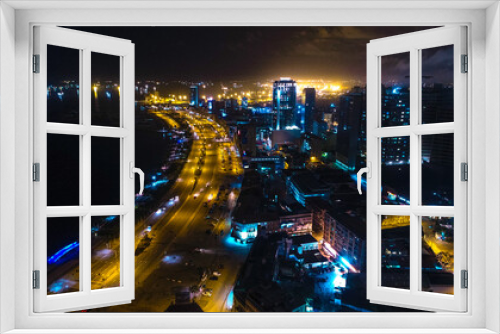 Fototapeta Naklejka Na Ścianę Okno 3D - Road, lights and sea at night.
Luanda city captured from the top