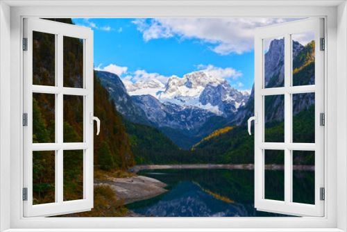 Fototapeta Naklejka Na Ścianę Okno 3D - Beautiful Gosausee lake landscape with Dachstein mountains, forest, clouds and reflections in the water in Austrian Alps