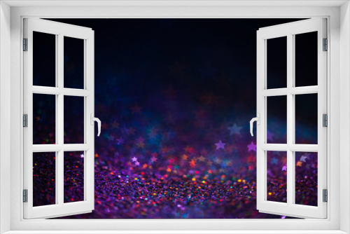 Decoration bokeh lights background, abstract blurred backdrop with stars, modern design wallpaper with sparkling glimmers. Purple, blue and pink backdrop glittering sparks with blur effect