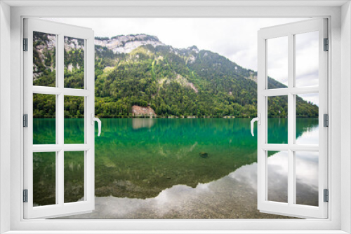 Fototapeta Naklejka Na Ścianę Okno 3D - Clear blue summer day at lake Klontalersee. Glarnisch, mountain range reflecting in the water. Landscape in Switzerland.