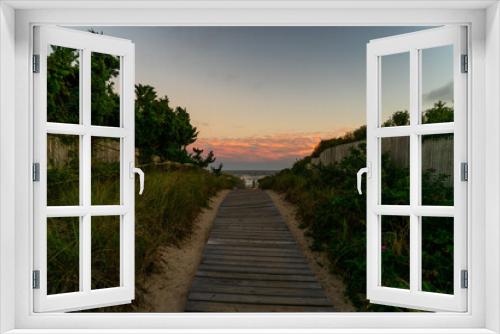 Fototapeta Naklejka Na Ścianę Okno 3D - Sunset over a beach path