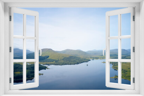 Fototapeta Naklejka Na Ścianę Okno 3D - Mindfulness calm background banner of aerial view from above loch at sunrise in Scotland