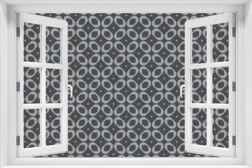  pattern of small oval elements with dots in gray tones.