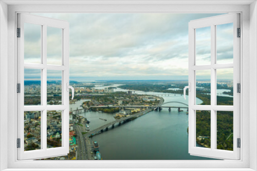 Fototapeta Naklejka Na Ścianę Okno 3D - Aerial view of the Dnipro River and districts of Kyiv - the largest city and capital of Ukraine.