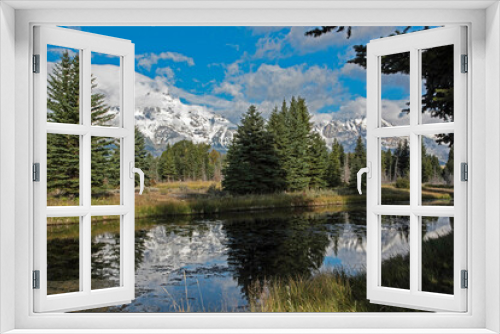 Fototapeta Naklejka Na Ścianę Okno 3D - Snow capped mountains and yellow leaves in the fall of The Grand Tetons.