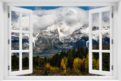 Fototapeta Naklejka Na Ścianę Okno 3D - Snow capped mountains and yellow leaves in the fall of The Grand Tetons.