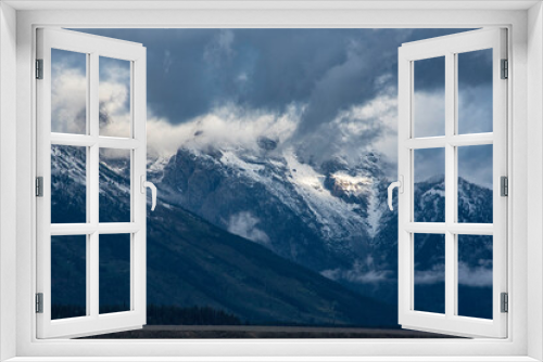 Fototapeta Naklejka Na Ścianę Okno 3D - Snow capped mountains and yellow leaves in the fall of The Grand Tetons.