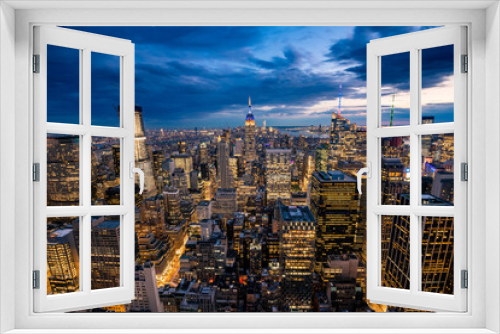 Fototapeta Naklejka Na Ścianę Okno 3D - City Lights sparkle with a view of the New York City skyline 