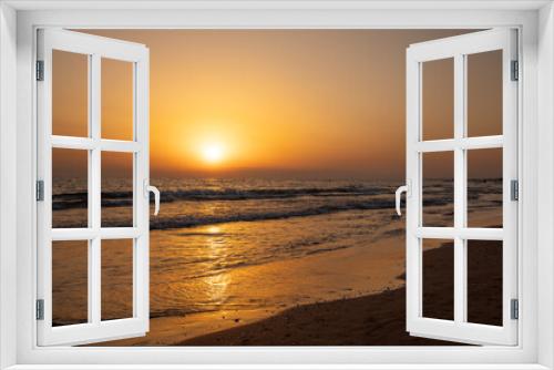 Fototapeta Naklejka Na Ścianę Okno 3D - Beautiful Sunset on the Beach with orange sky and yellow sunlight reflection  