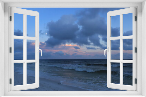 Fototapeta Naklejka Na Ścianę Okno 3D - View of the evening sea and the sky above it with clouds and the moon