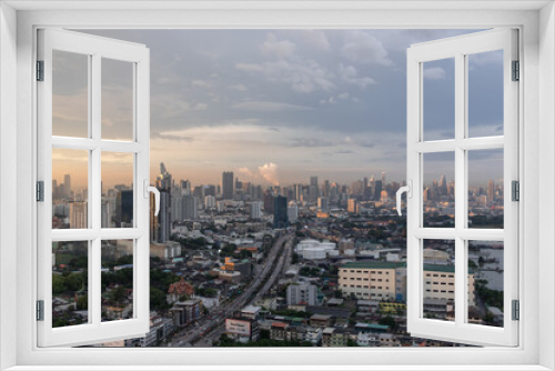 Fototapeta Naklejka Na Ścianę Okno 3D - Bangkok, Thailand - Oct 20, 2020 : City view of Bangkok before the sunset creates energetic feeling to get ready for the day waiting ahead. Copy space, Selective focus.