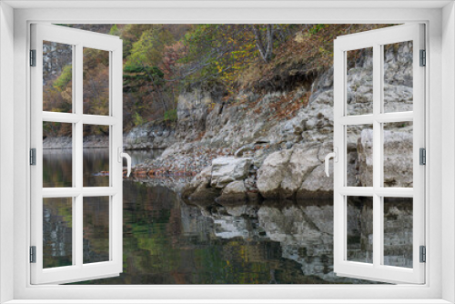 Fototapeta Naklejka Na Ścianę Okno 3D - Reflections by the lake on a sunny autumn day