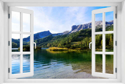 Fototapeta Naklejka Na Ścianę Okno 3D - Wonderful vacations on the region Salzkammergut in Austria; hiking on the waterside  of the lakes on the Tauplitz-Alm (alpine pasture); panoramic view with hills and reflections on the water.