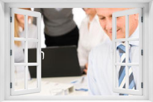 Businessman use phone during team meeting