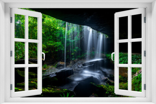 Fototapeta Naklejka Na Ścianę Okno 3D - A small waterfall in the deep forest of the border of Thailand and Cambodia,ASIA.Khun Sri waterfall in tropical forest,Sisaket province,Thailand. Leaf moving low speed shutter blur.