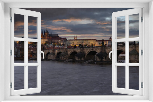 Fototapeta Naklejka Na Ścianę Okno 3D - view of Prague Castle and the Cathedral of St. Vitus and Charles Bridge from the 14th century in the center of Prague at the sunset of the moon and the sky is colored