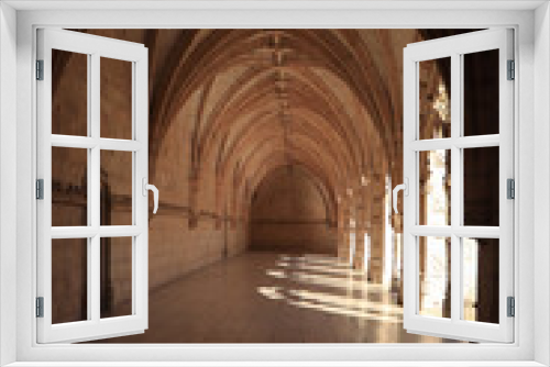 Fototapeta Naklejka Na Ścianę Okno 3D - Archway of an old monastery. Cloisters of Jeronimos Monastery. Lisbon Portugal
