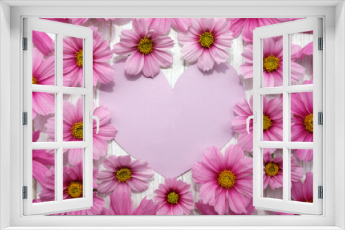 Fototapeta Naklejka Na Ścianę Okno 3D - Background with frame of pink flowers and heart card on white wood. Concept for mothers day, valentines day, womens day.