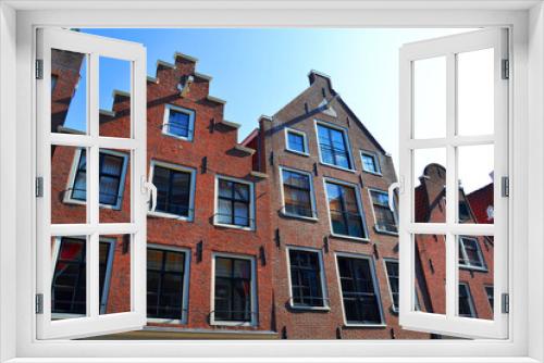 Fototapeta Naklejka Na Ścianę Okno 3D - Traditional dutch architecture, facades of houses in Amsterdam, The Netherlands.