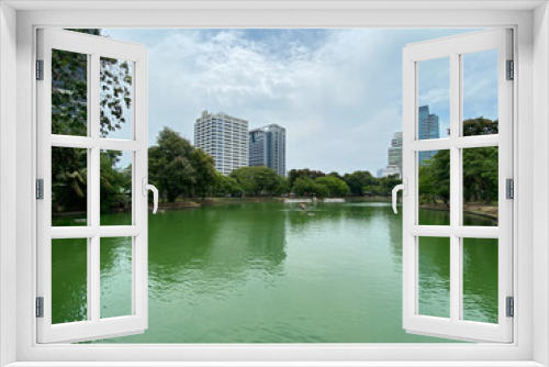Fototapeta Naklejka Na Ścianę Okno 3D - View across pond in park 
