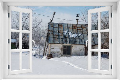 Fototapeta Naklejka Na Ścianę Okno 3D - Dachas and summer cottages in the suburbs in winter.