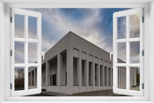 Fototapeta Naklejka Na Ścianę Okno 3D - Modern сrematorium building under the blue sky
