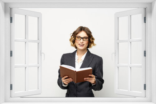 Business woman with notepad and glasses work light background cropped view of suit model.