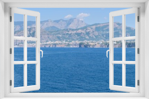 Fototapeta Naklejka Na Ścianę Okno 3D - Panorama of the Amalfi Coast with Sorrento cliffs and mountains and the Mediterranean Sea, from Regina Giovanna beach in the Gulf of Naples, Campany, Italy