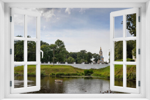 Fototapeta Naklejka Na Ścianę Okno 3D - Uglich Kremlin. view of the historic building of the city Council and The Church of the Kazan icon of the mother of God from the Stone stream