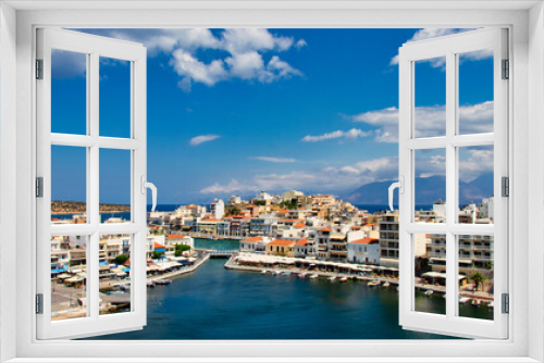 Fototapeta Naklejka Na Ścianę Okno 3D - View of the bay of Agios Nikolaos with the famous port and buildings