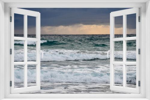 Fototapeta Naklejka Na Ścianę Okno 3D - The rough waters of the Mediterranean Sea at the beach at Agia Napa, Cyprus, after a thunderstorm in winter