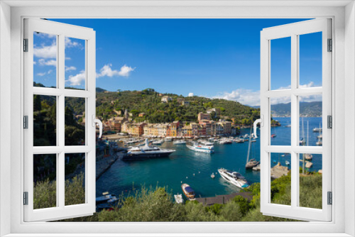 Fototapeta Naklejka Na Ścianę Okno 3D - PORTOFINO, ITALY, SEPTEMBER 1, 2020 - Aerial view of Portofino, an Italian fishing village, Genoa province, Italy. A famous tourist place with a picturesque harbour and colorful houses.