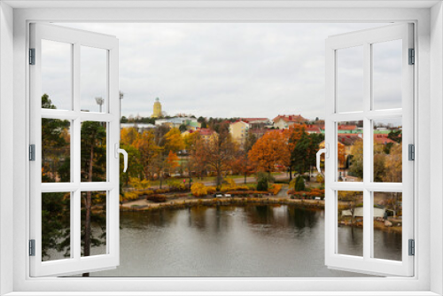 Fototapeta Naklejka Na Ścianę Okno 3D - Beautiful urban autumn landscape with a calm lake. Panoramic view of the town of Kotka, Finland.