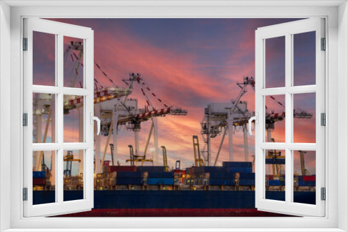 Fototapeta Naklejka Na Ścianę Okno 3D - View of container cargo ship and crane bridge in shipyard at sunrise