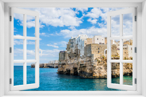 Fototapeta Naklejka Na Ścianę Okno 3D - Cliffs of Polignano a Mare on a warm and sunny day, Puglia, Italy