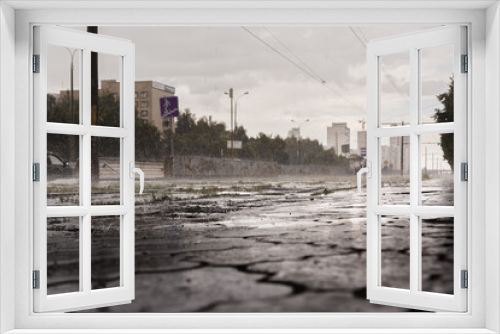 Fototapeta Naklejka Na Ścianę Okno 3D - On the rainy street, waterdrops and wet asphalt
