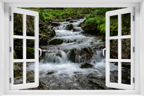 Fototapeta Naklejka Na Ścianę Okno 3D - Stream of a creek with cascades