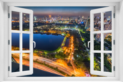 Fototapeta Naklejka Na Ścianę Okno 3D - Panoramic View of Bangkok, Thailand. Cityscape with Public Park and Skyscrapers at Twilight
