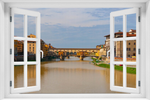 Fototapeta Naklejka Na Ścianę Okno 3D - The ancient Ponte Vecchio across the river Arno in Florence, Italy